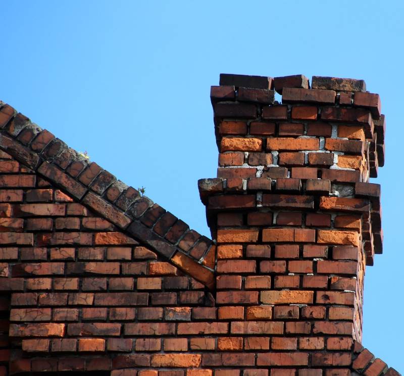 Damaged chimney on an Chillum home showing cracks and missing mortar